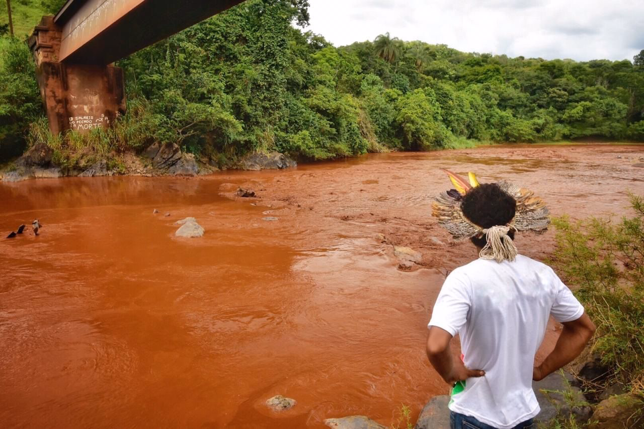 Tailings mud from Brumadinho disaster surrounding a vehicle