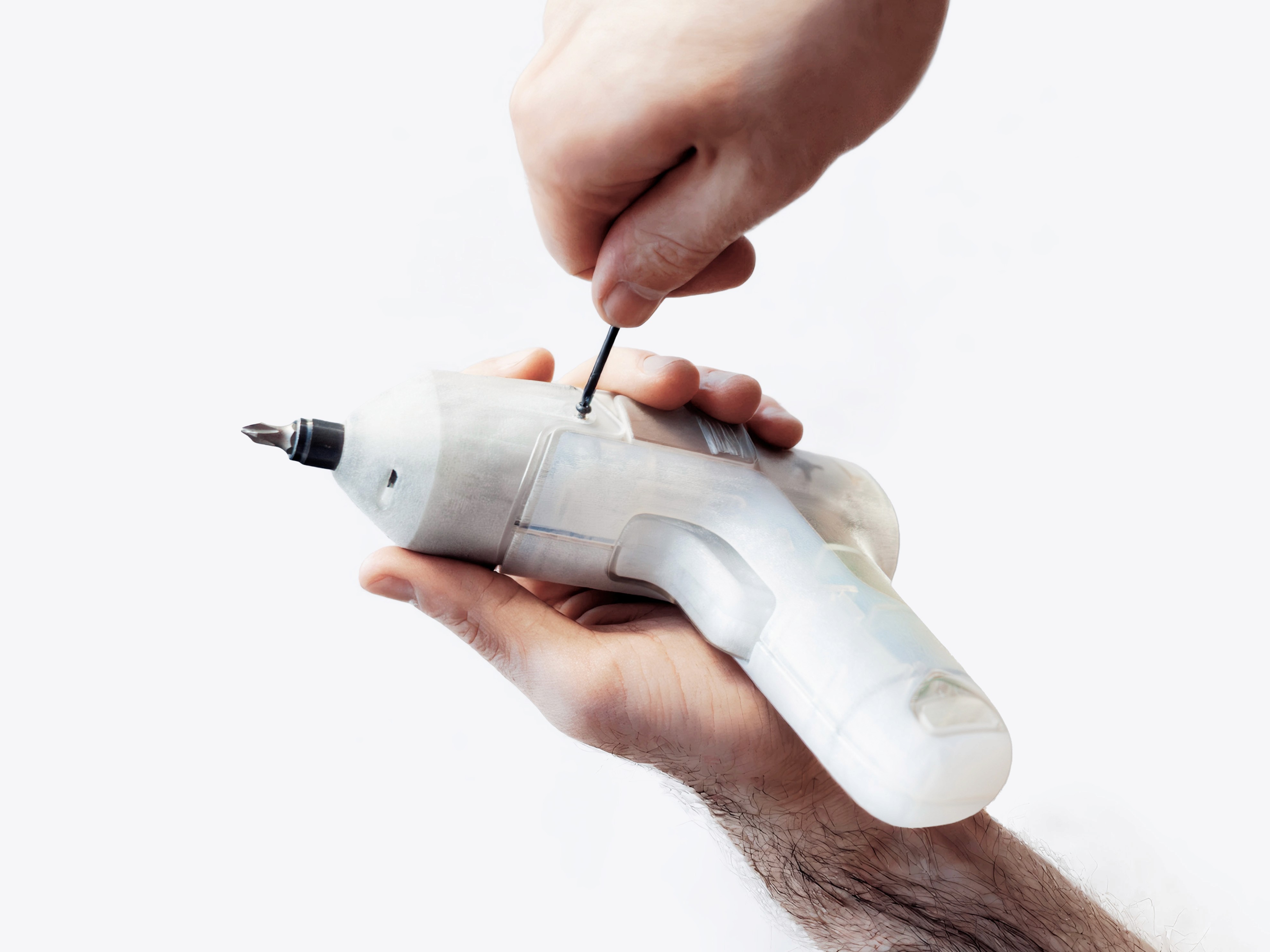 Hand holding functional prototype with integrated drill bit for balance testing